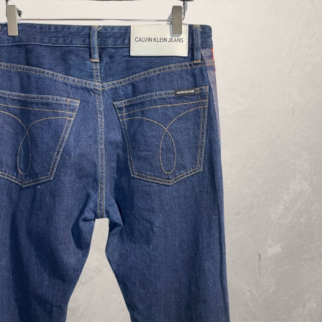 Calvin Klein Jeans by RAF SIMONS donkerblauwe denim rode streep 32x32